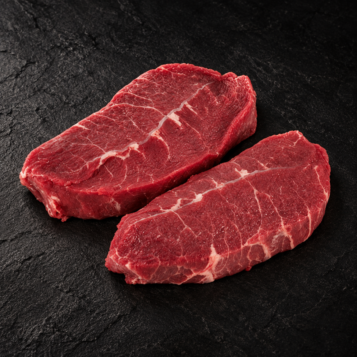 Sucadelappen op donkere natuursteen – Meat & Go
